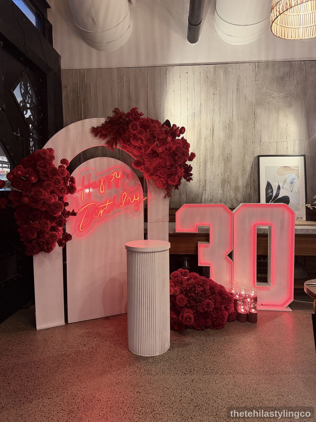 Luxury birthday backdrop with red florals and neon
