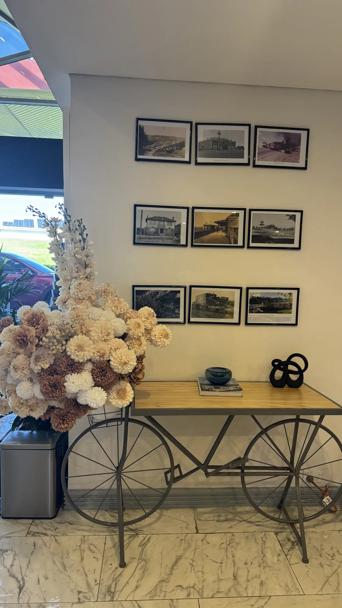 Neutral-toned floral arrangement in a hotel lobby